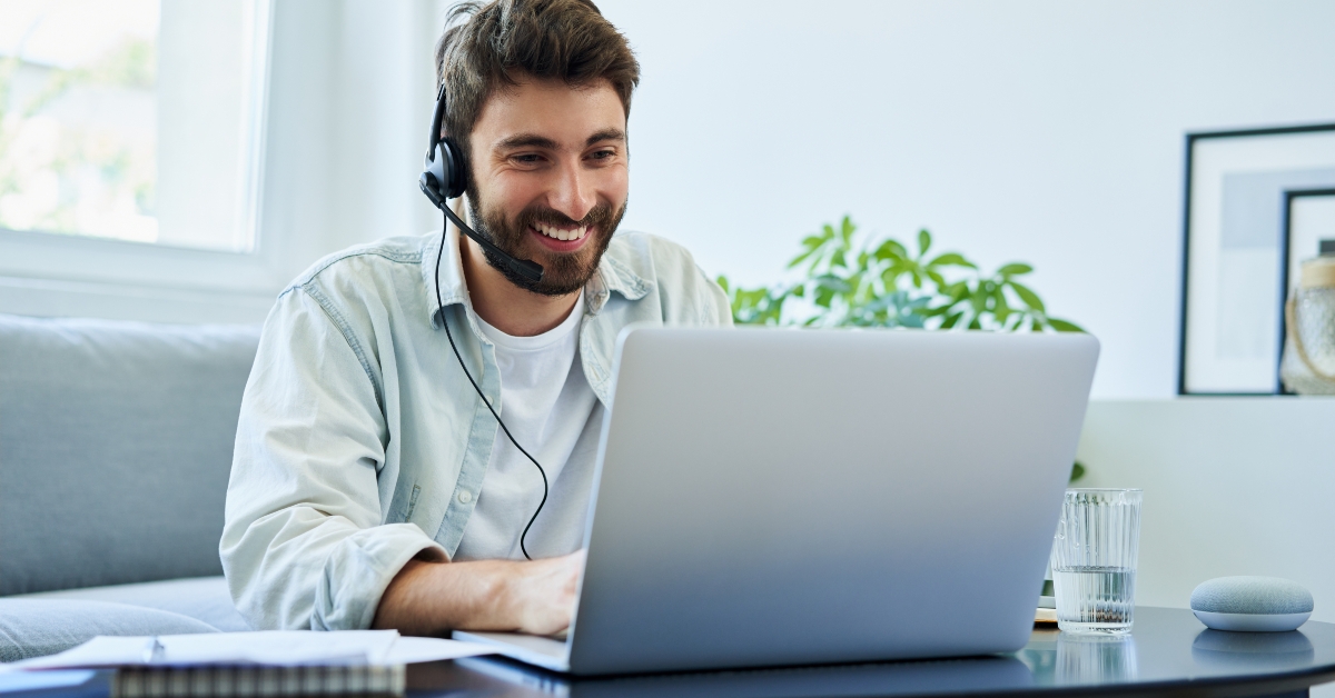 man with headset telecommuting