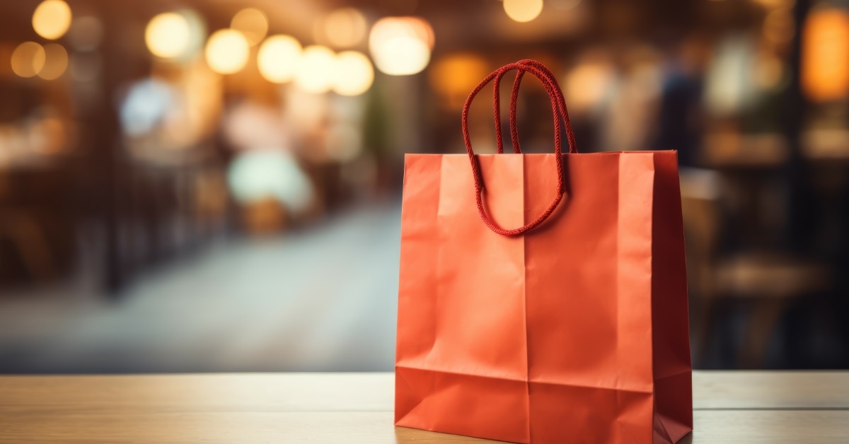 red shopping bag with bookeh background