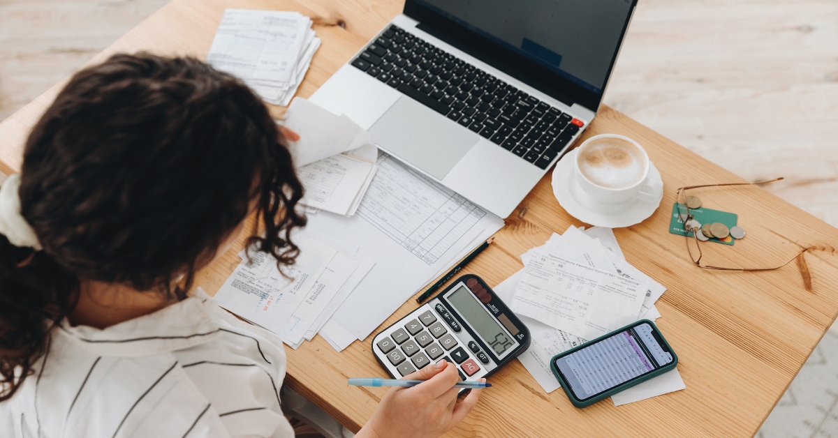 woman counting on a calculator