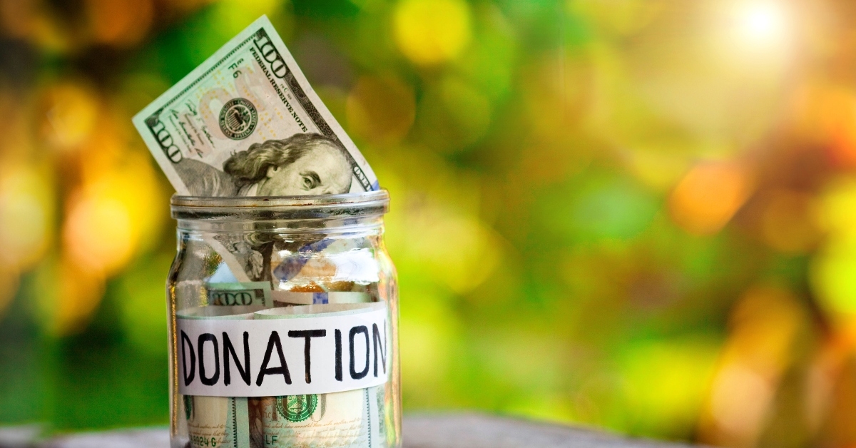 glass jar with dollars