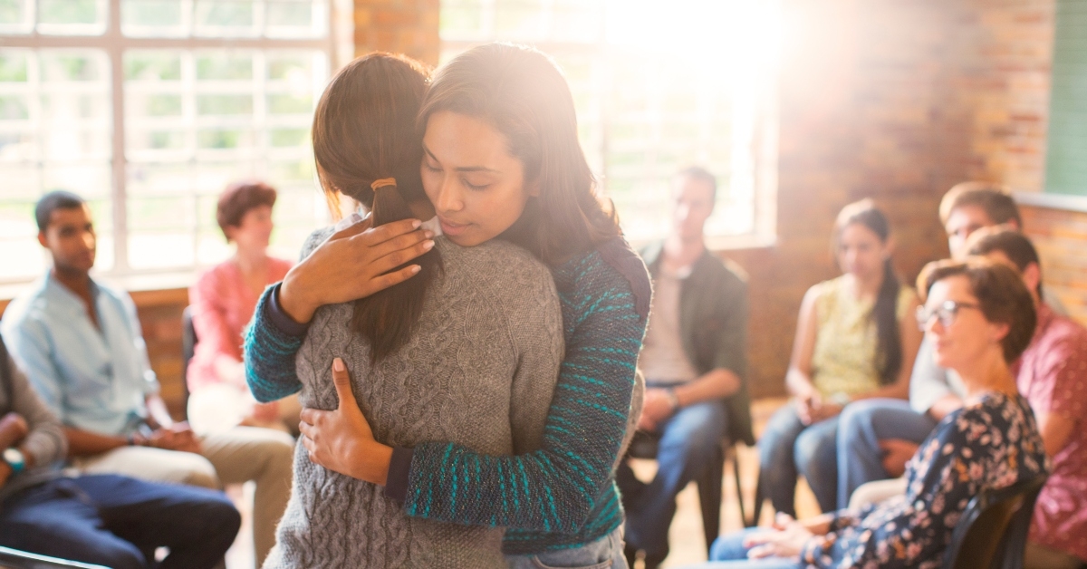 hugging in group therapy session