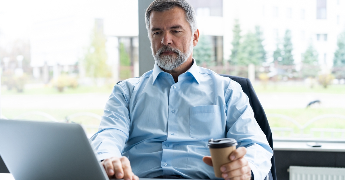 senior businessman working on laptop