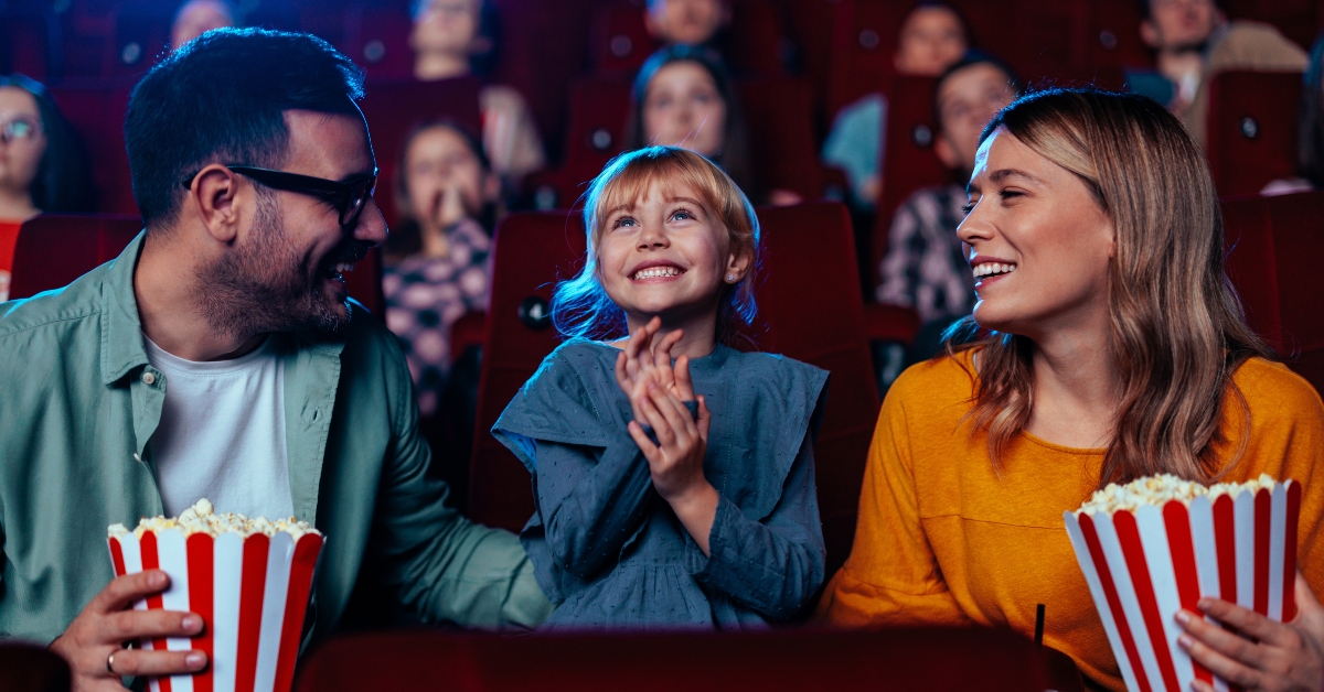 family watching movie in theater