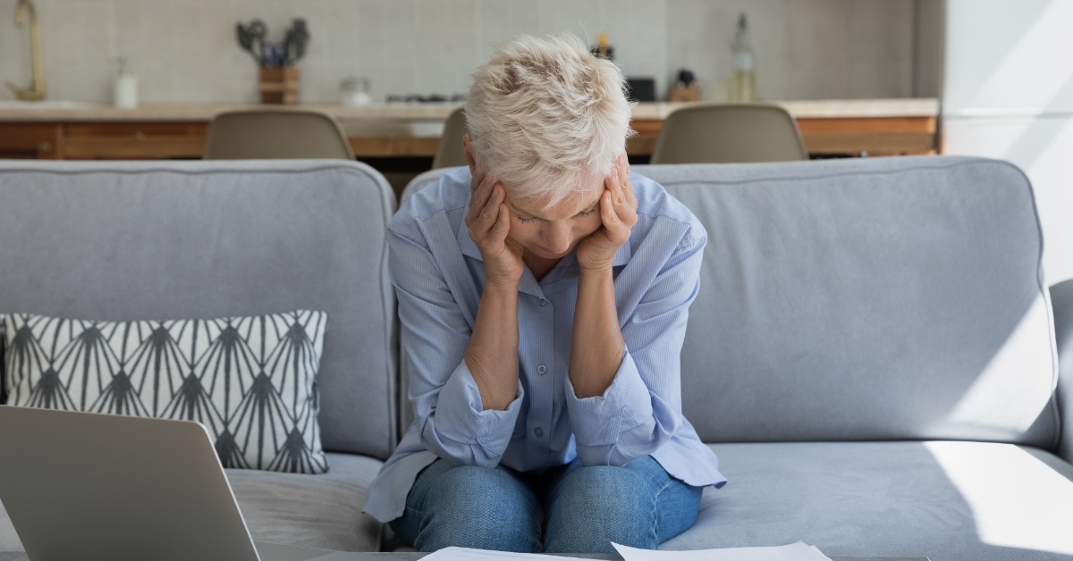senior woman stressed while working
