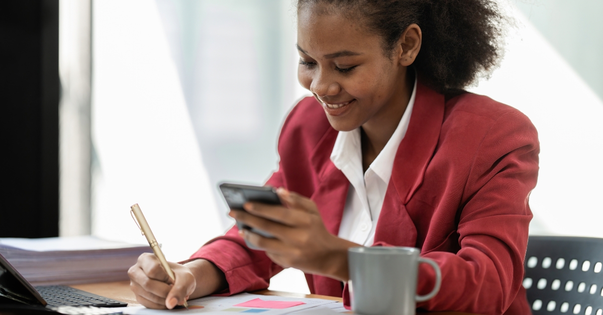 black businesswoman using cell phone