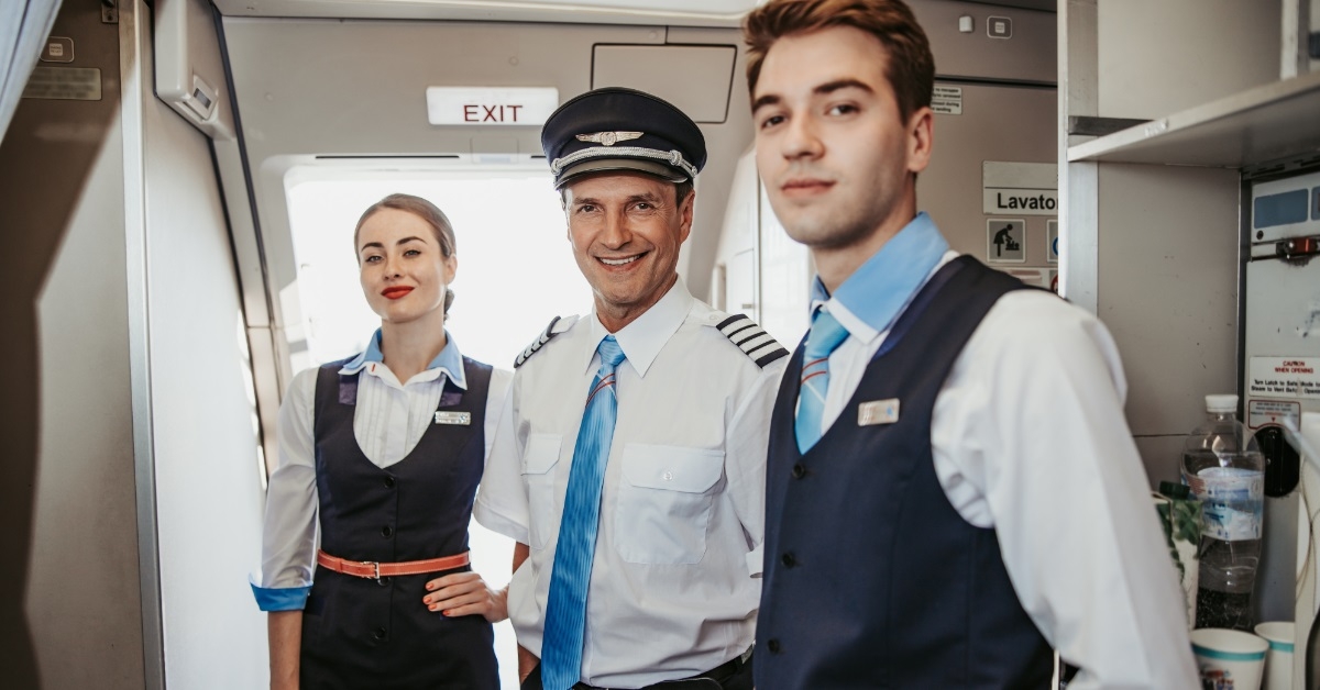 pilot with flight attendants on board