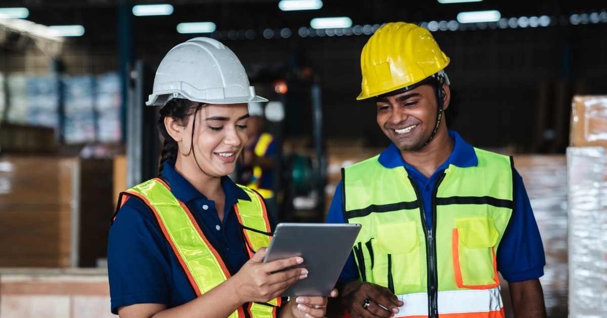 warehouse workers using tablet at work