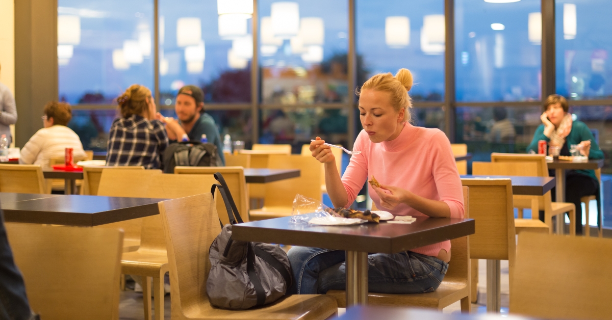 eating pizza at airport restaurant