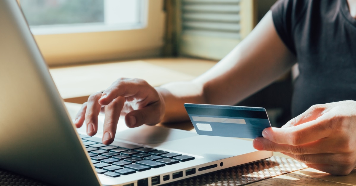 woman making online purchase using card