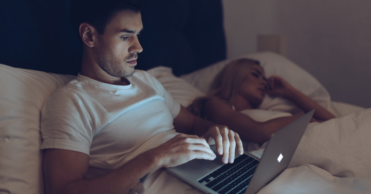 suspicious young man using laptop