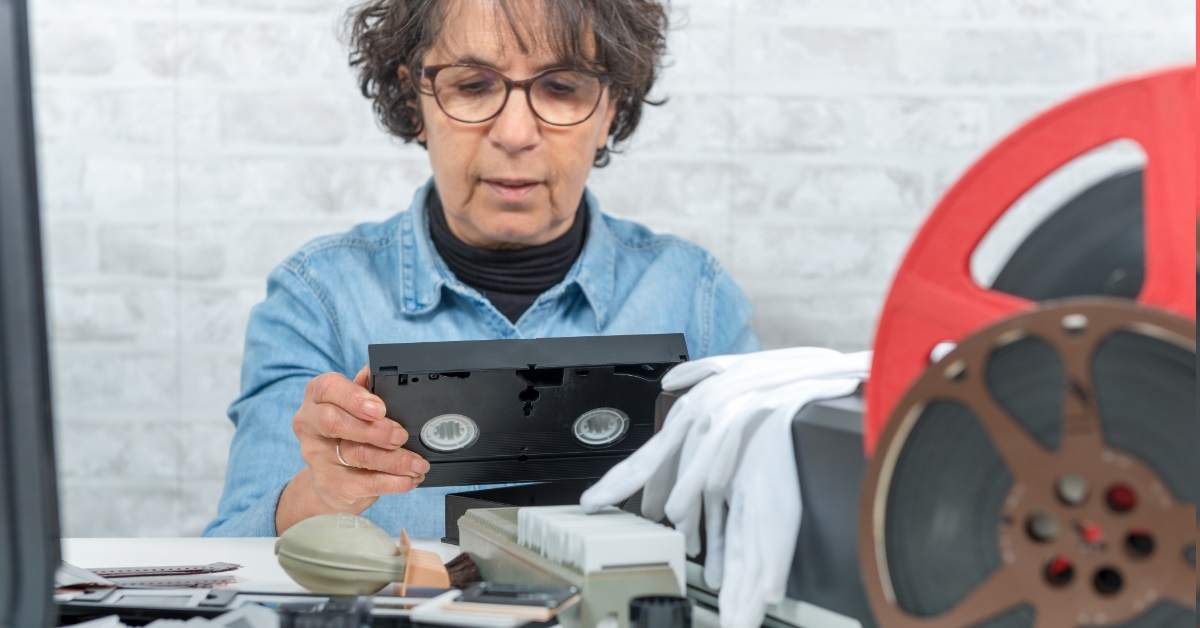 technician-woman-digitizing-VHS-cassette