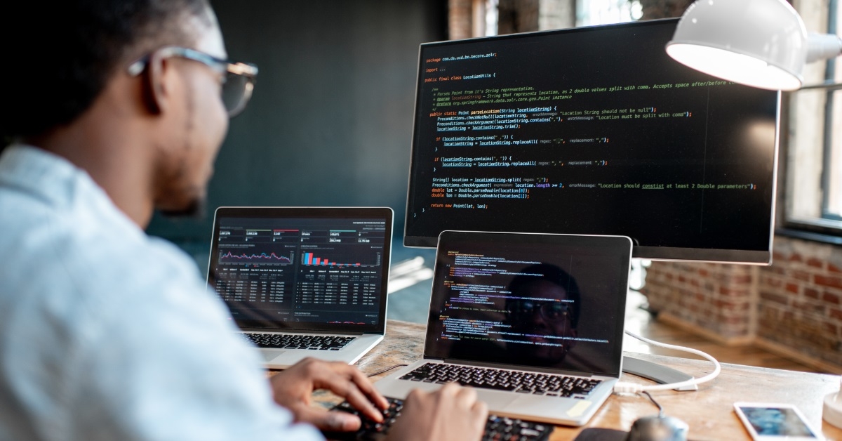 male programmer coding at home