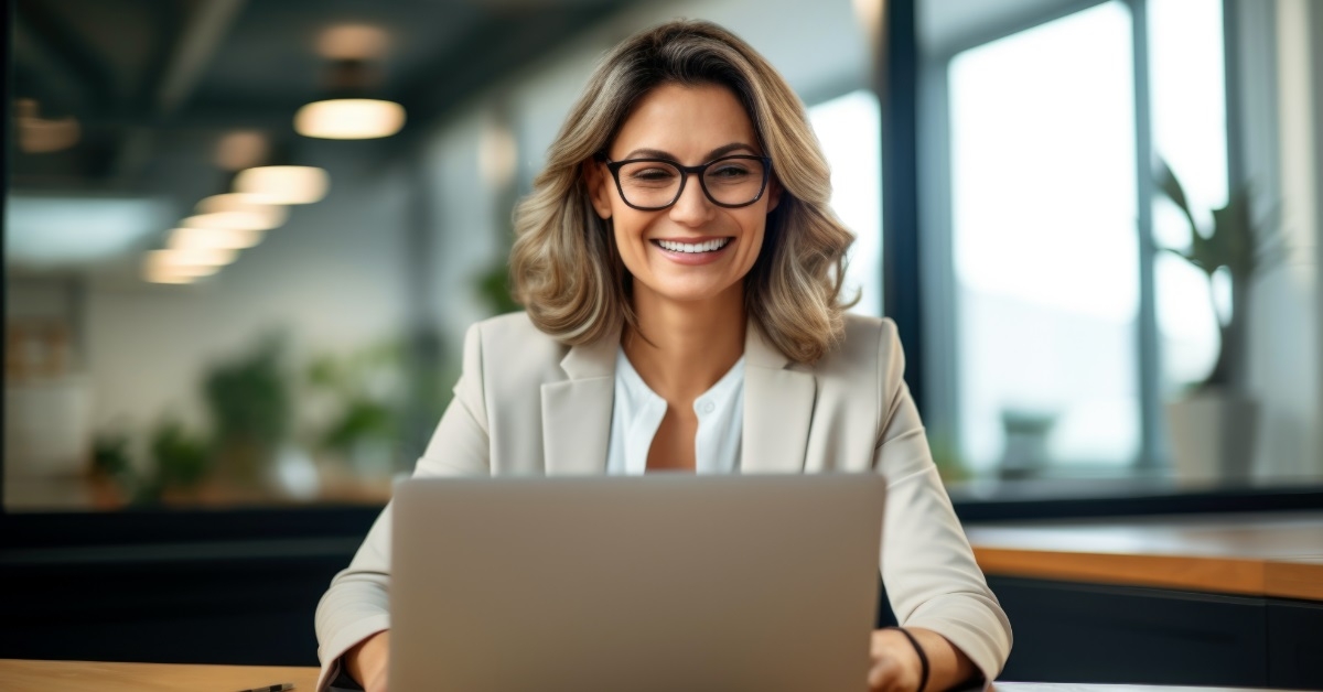 happy business woman using laptop