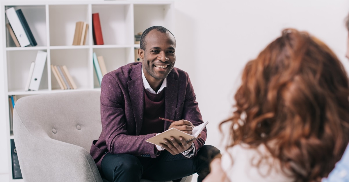 african american psychiatrist with young couple