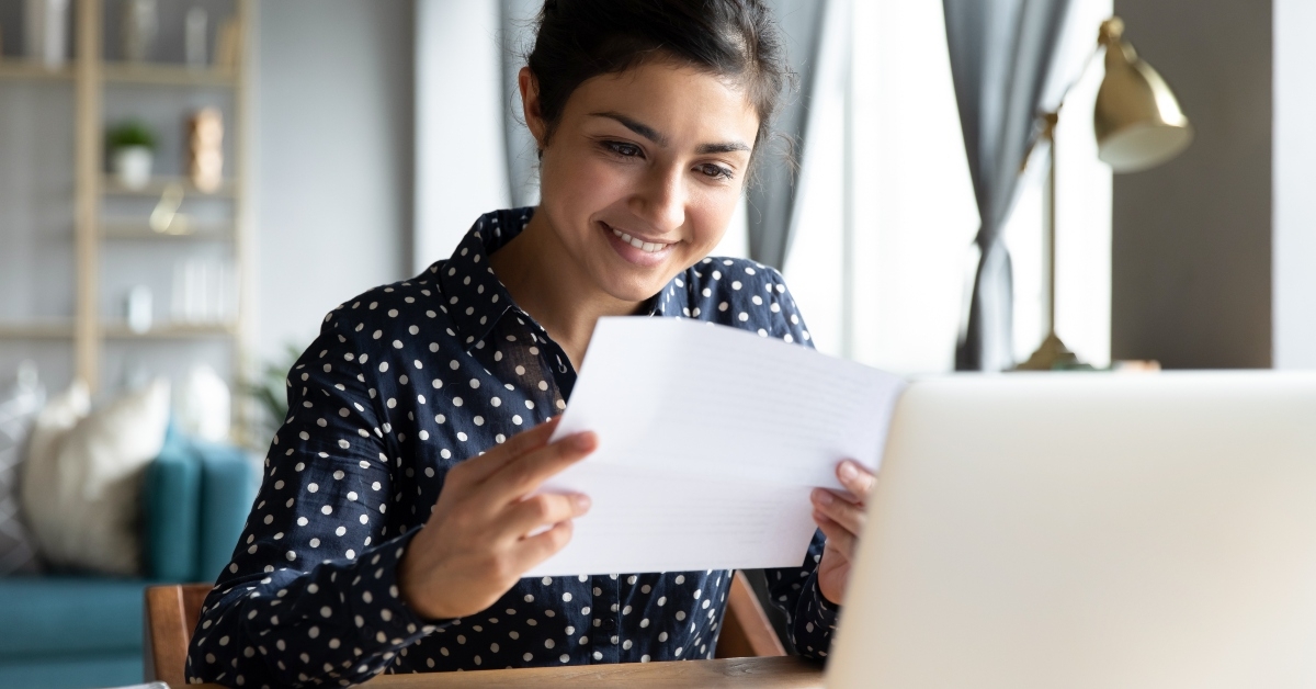 indian woman reading paper