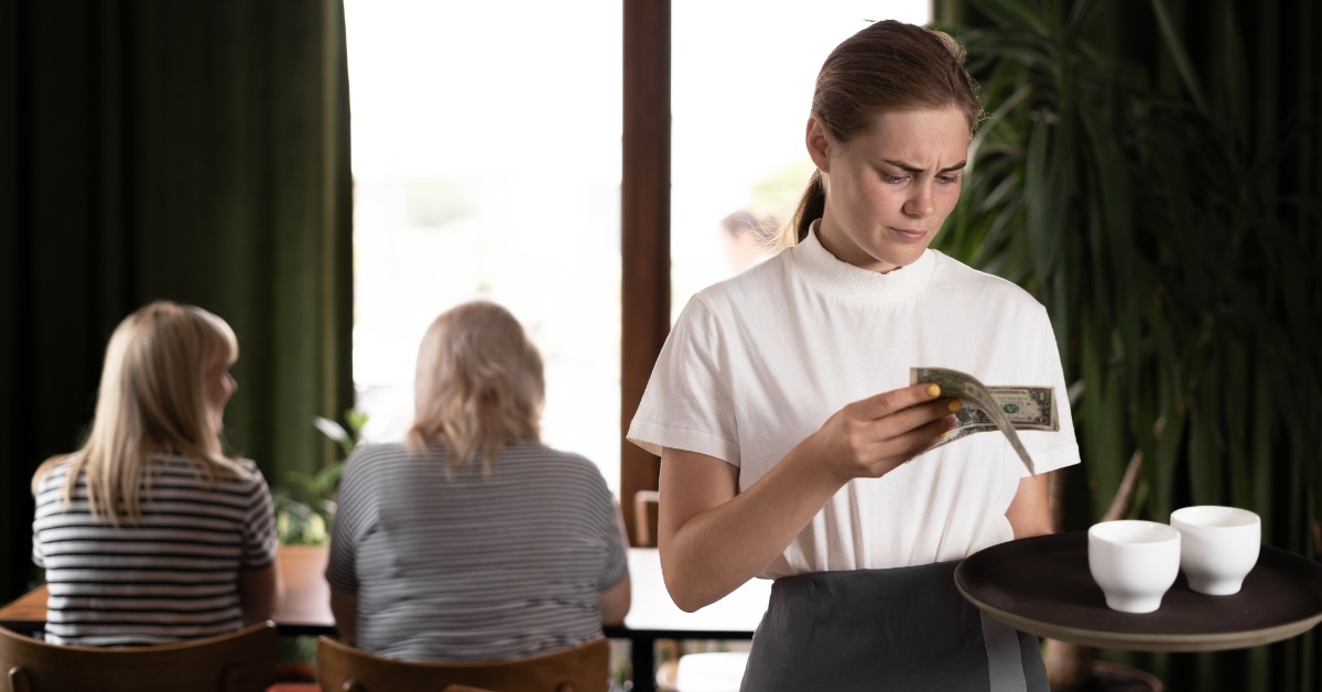 female waitress unhappy about tips received
