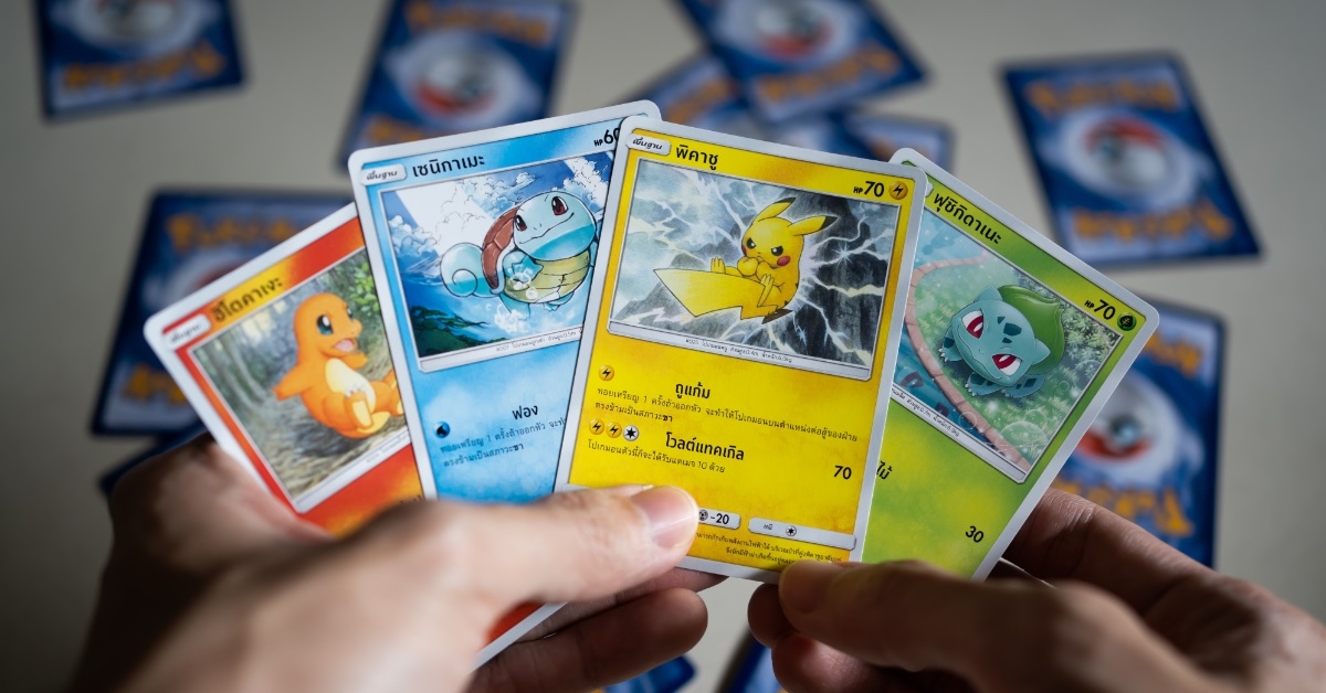 man playing pokemon trading card game