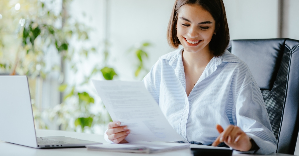 accountant with paper and calculator