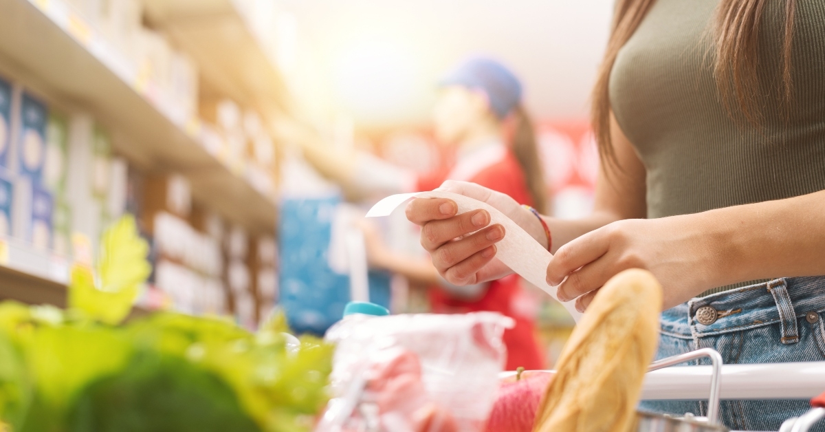 woman checking the grocery receipt