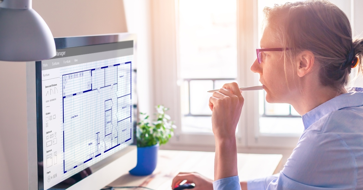 architect designing blueprint