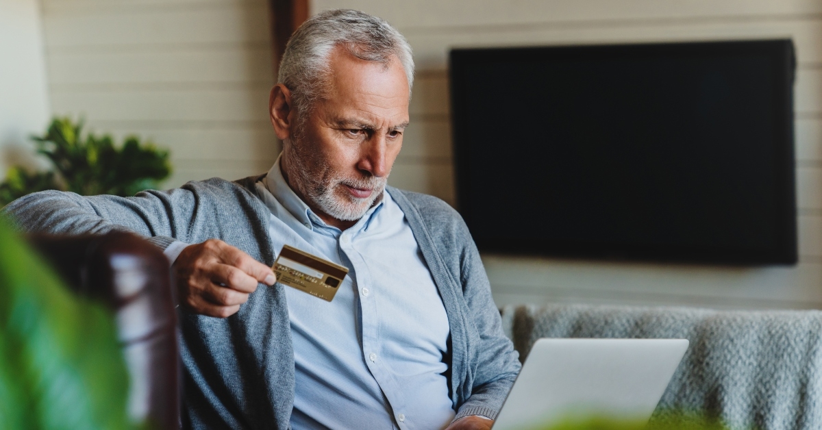 senior man sitting on sofa