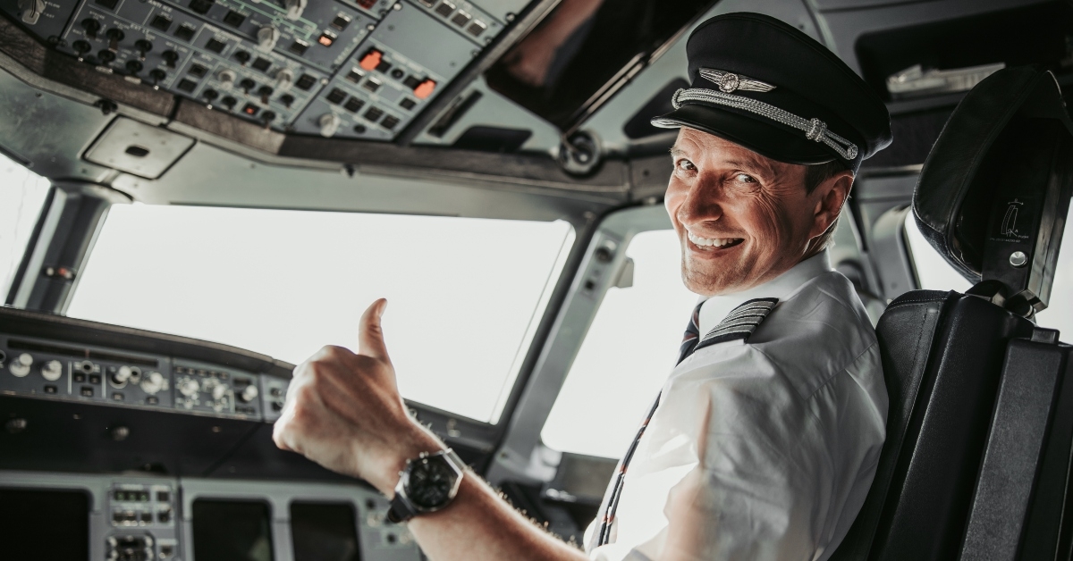 smiling pilot in cockpit
