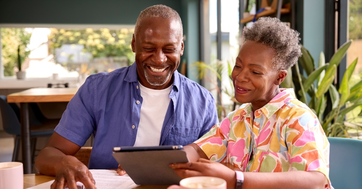 senior couple using digital tablet