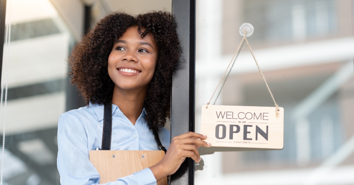 african american female manager opening store