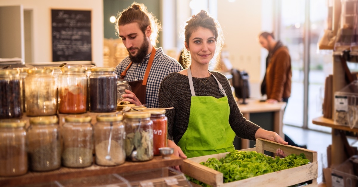 couple working at whole foods store