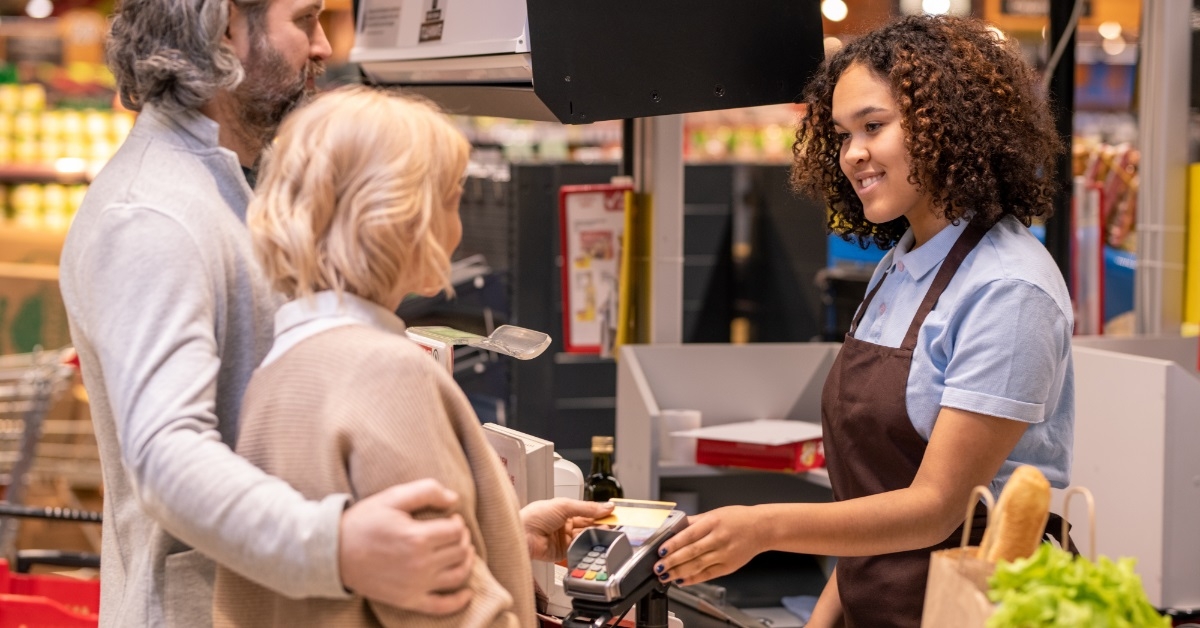 senior couple at checkout counter