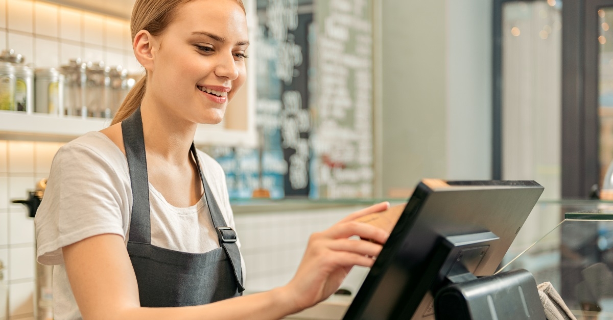 female shop assistant at cashier counter