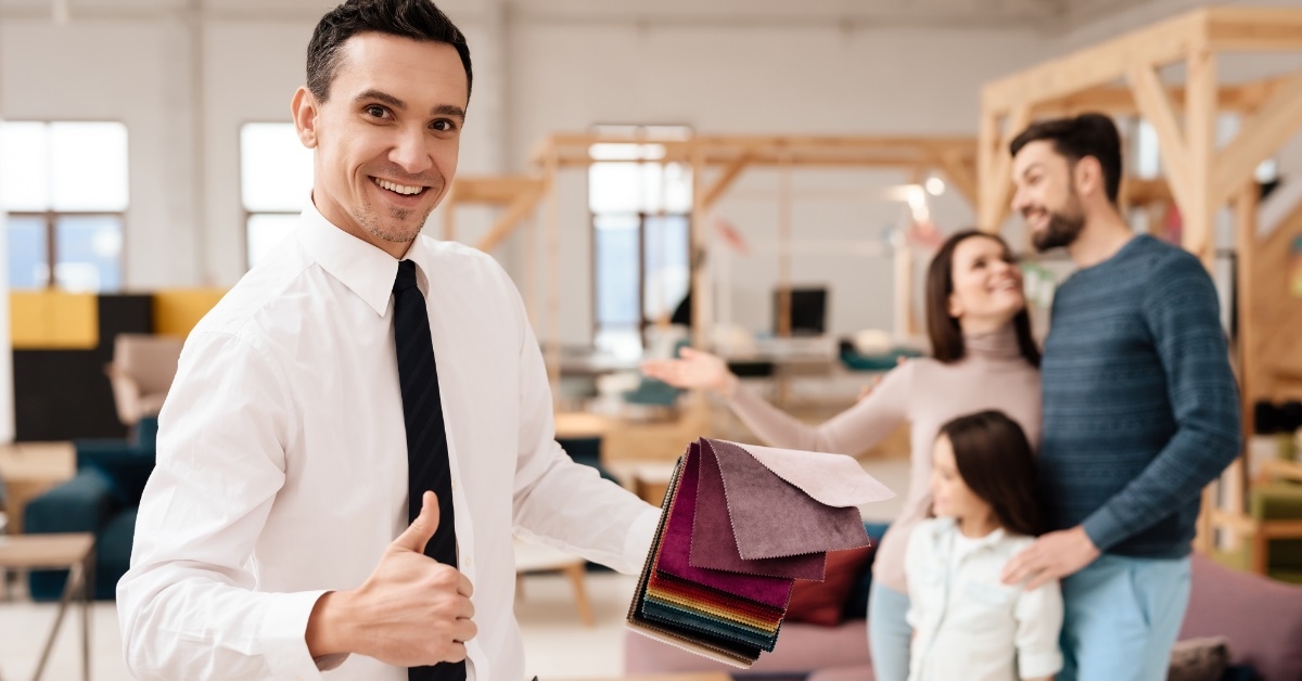 sales agent posing at furniture store