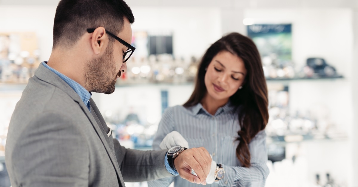 saleswoman showing luxury watches to client