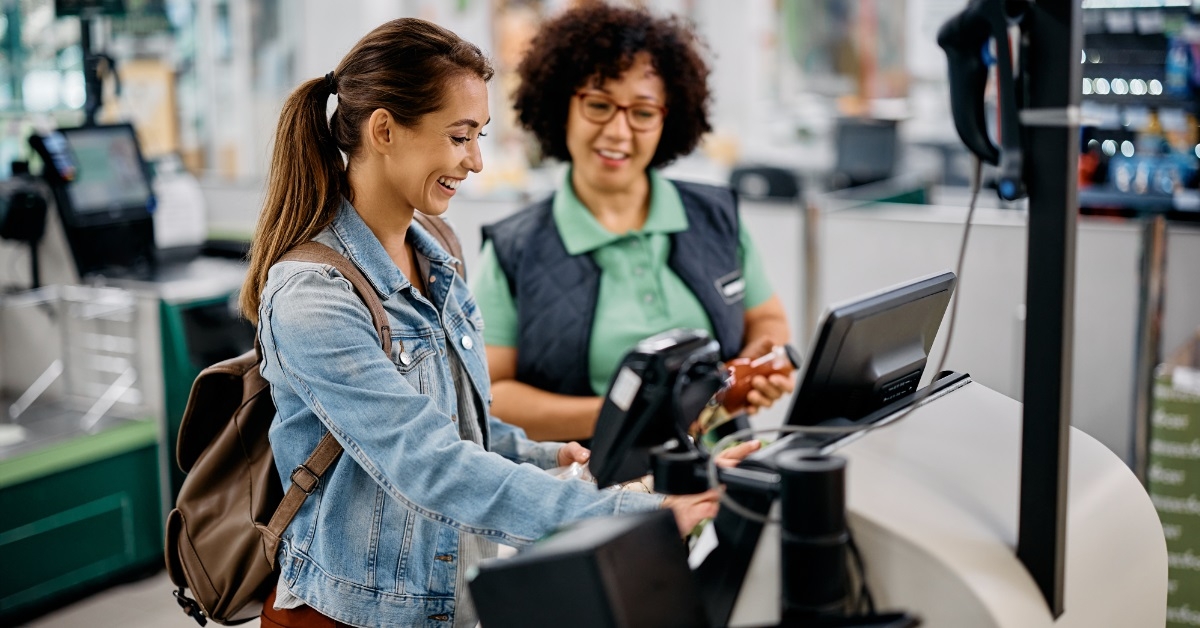 woman using self checkout services