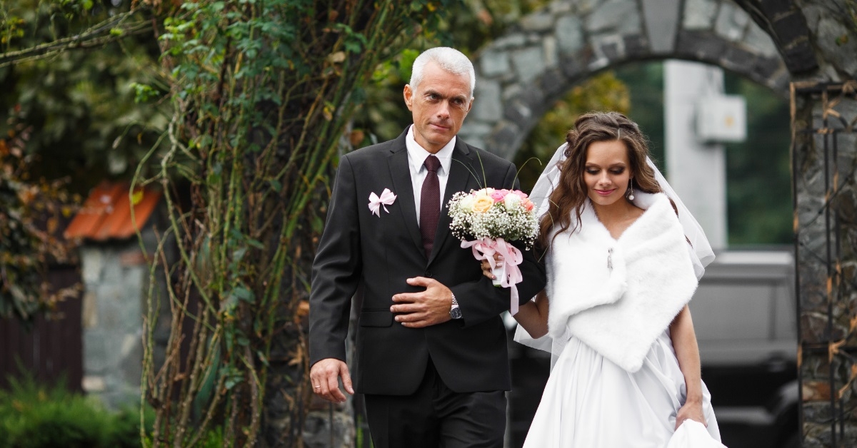 father walking bride down aisle