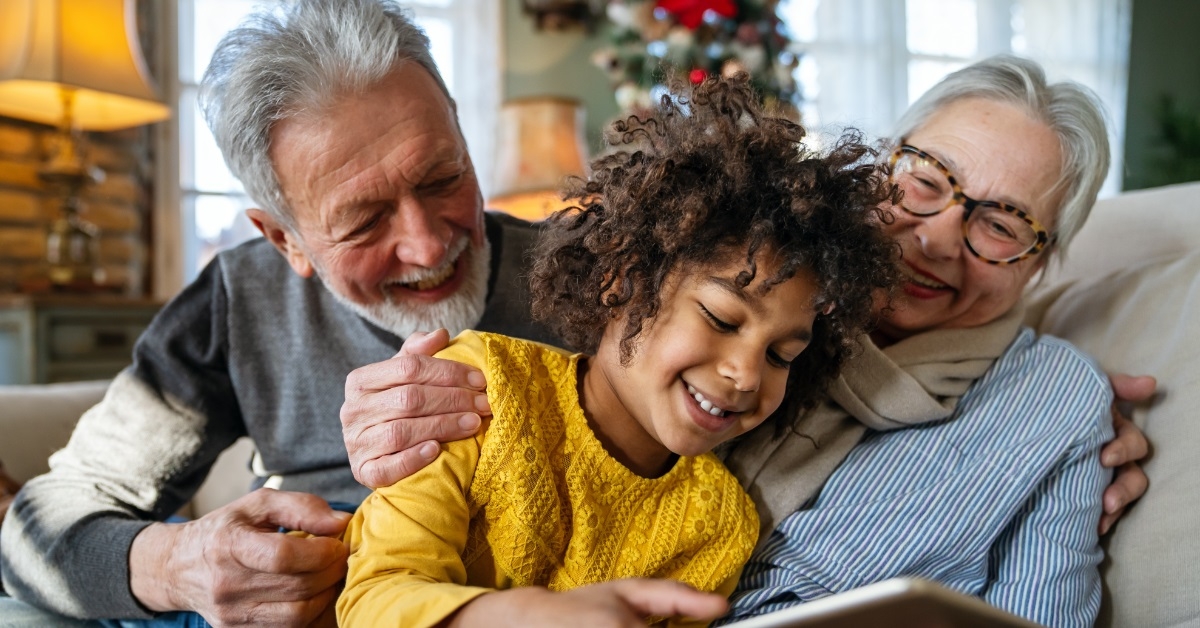 grandparents playing with grandchild