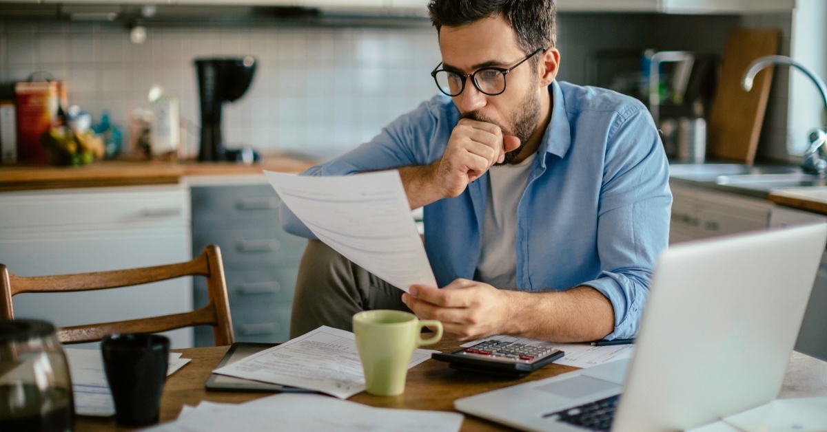 man going over his bills