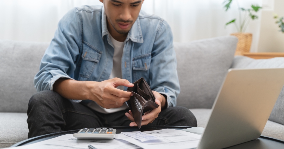 man opening empty wallet