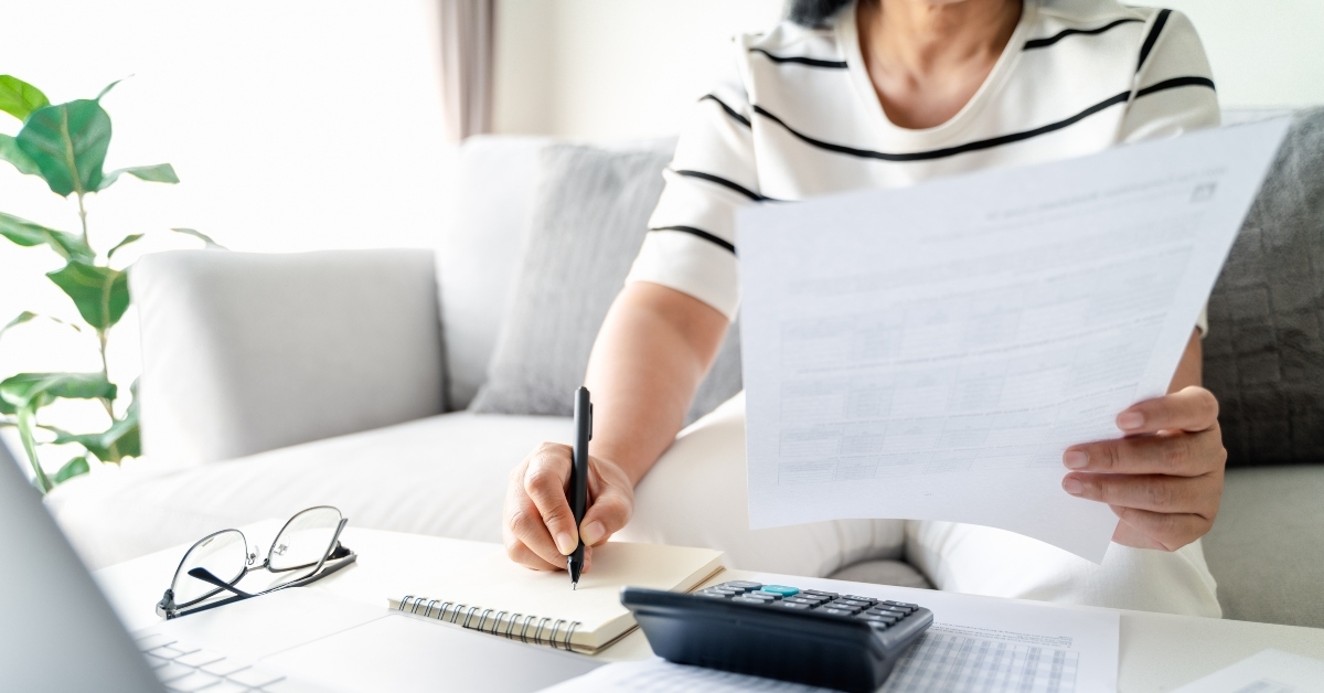 woman calculating annual tax 