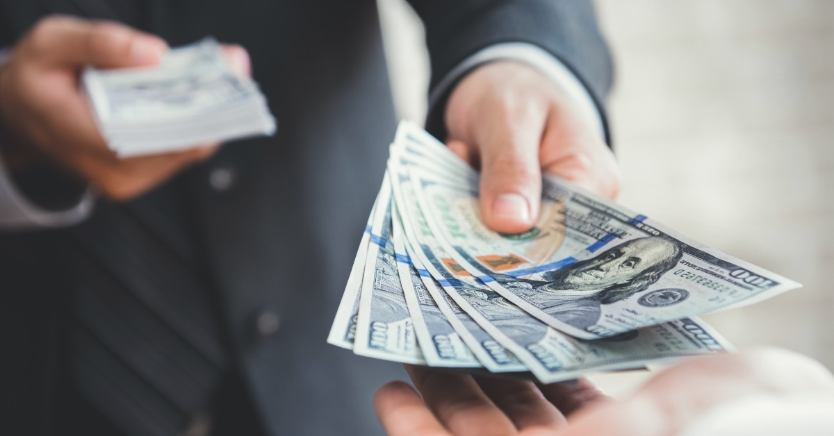 businessman giving money