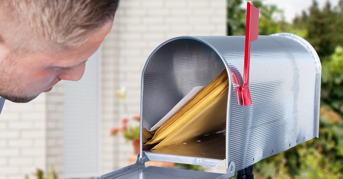 man checking mailbox for mails
