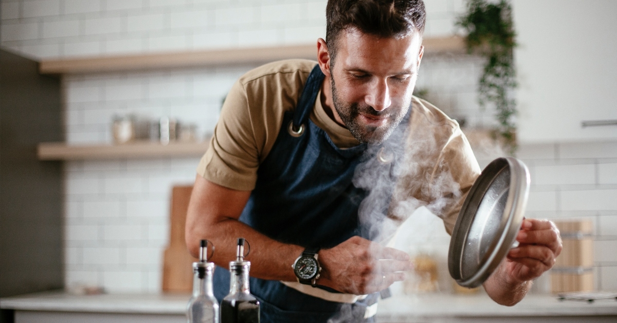 man preparing pasta