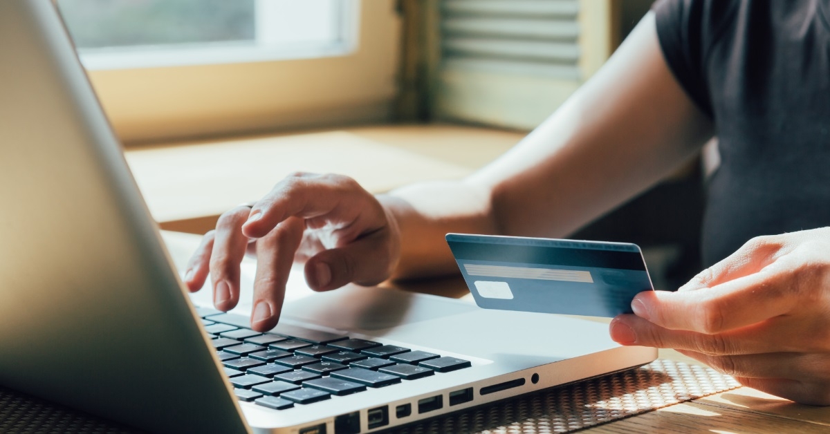 woman shopping online using card