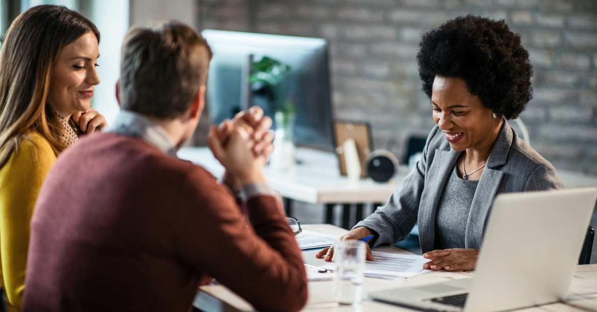 African American financial advisor with couple