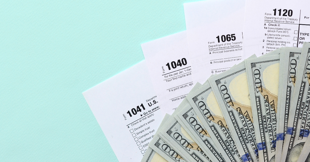 tax-forms-and-dollar-bills