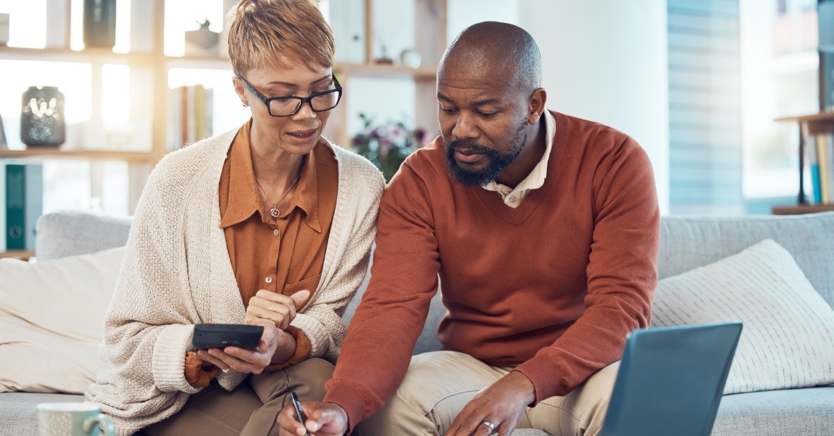 african american couple reviewing bills