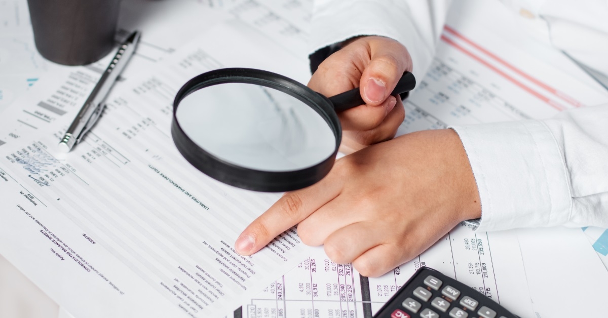 business woman reviewing annual balance sheet