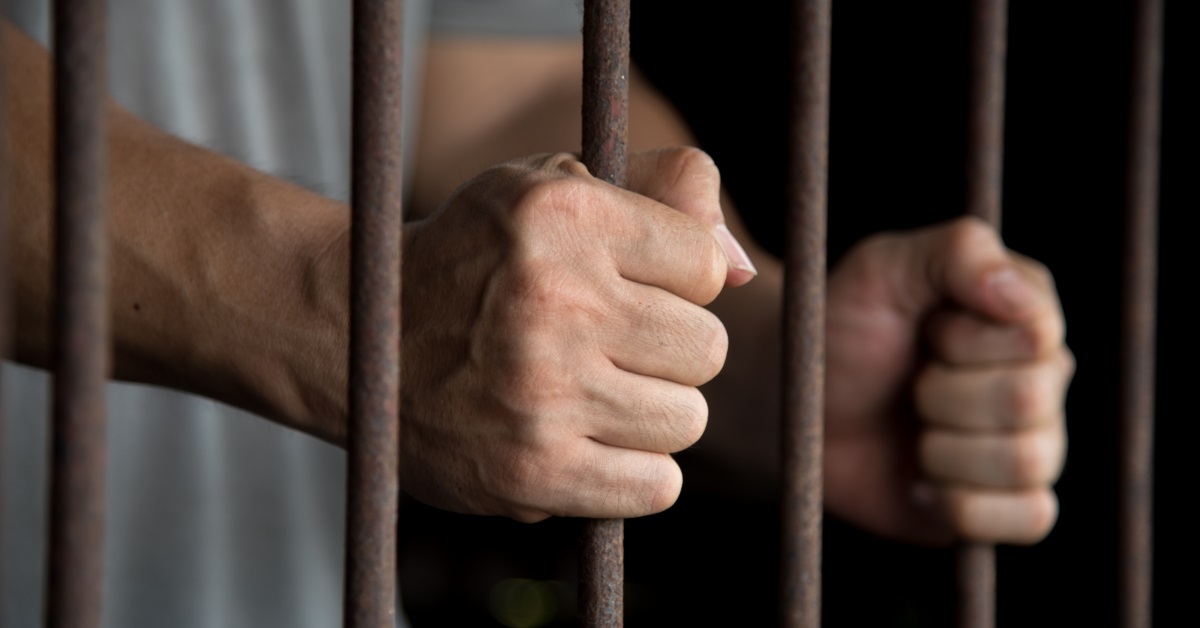 hands of prisoner in jail