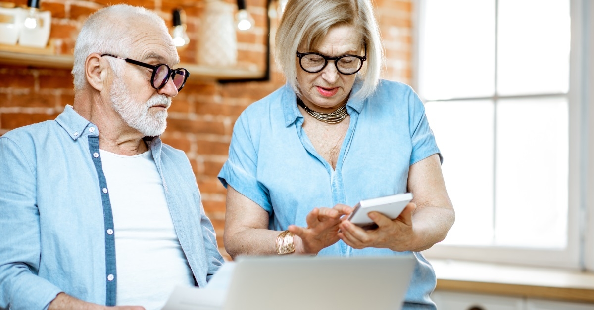 senior couple reviewing bills together
