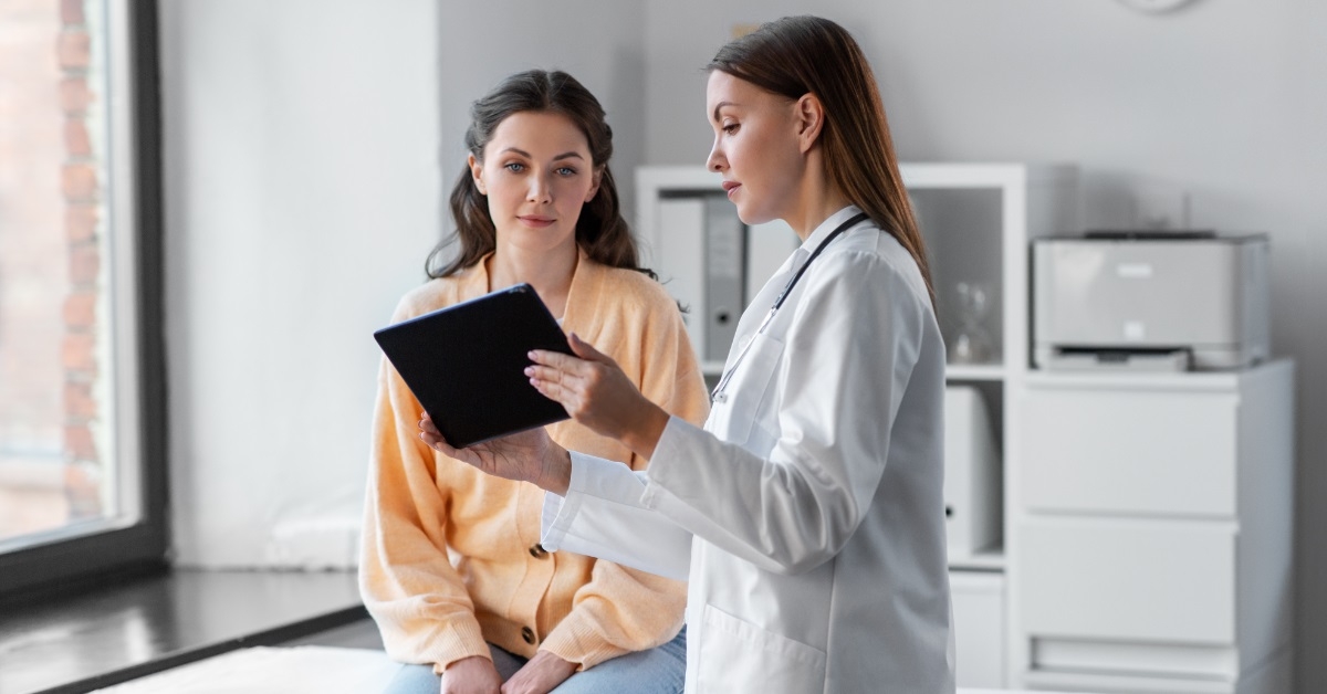doctor explaining treatment to female client
